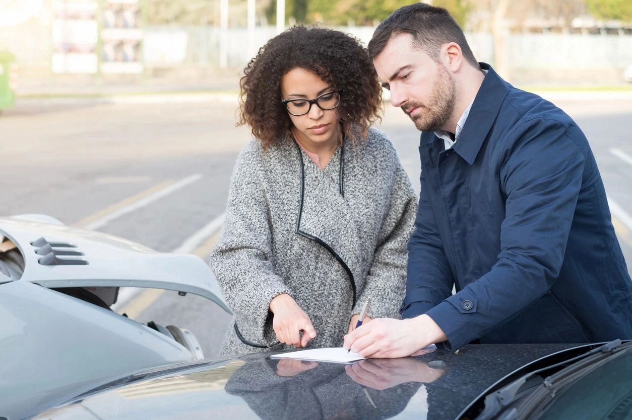 Professionals reviewing insurance documents